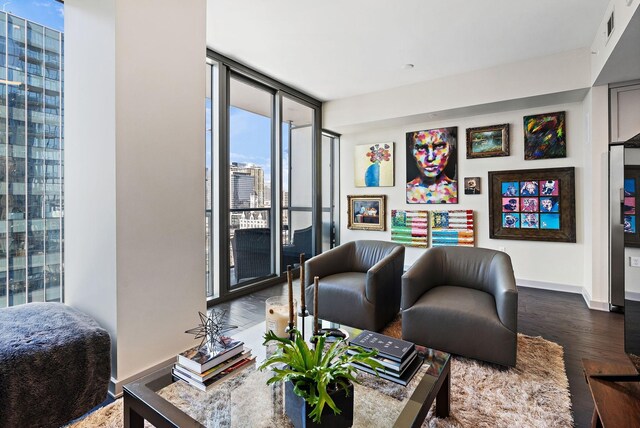 living room with floor to ceiling windows and hardwood / wood-style floors