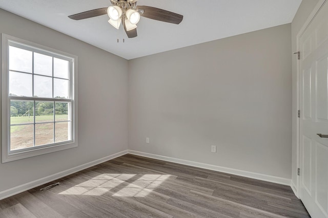 unfurnished room with hardwood / wood-style flooring and ceiling fan