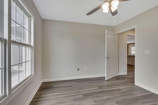 unfurnished room featuring ceiling fan and hardwood / wood-style floors