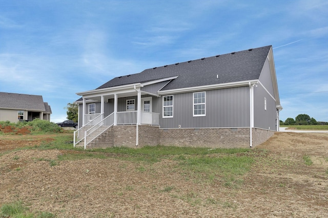 back of property with covered porch