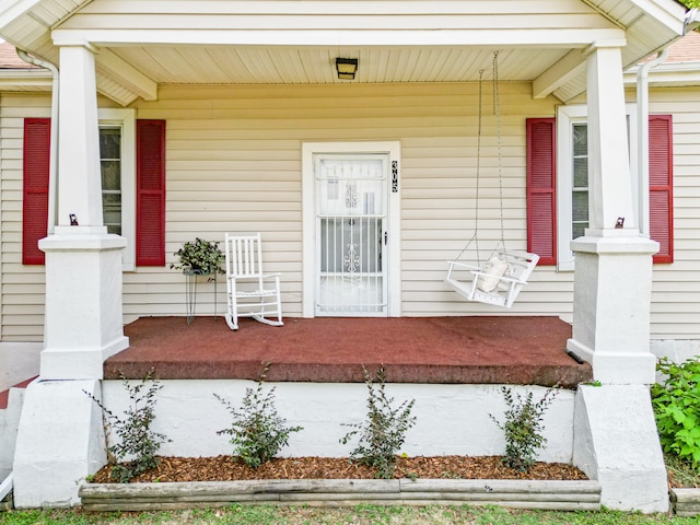 doorway to property with covered porch