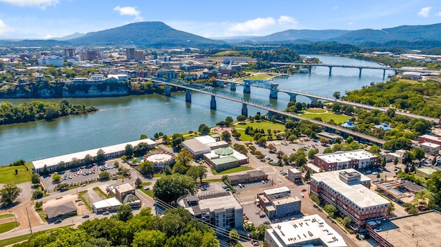 aerial view featuring a water and mountain view