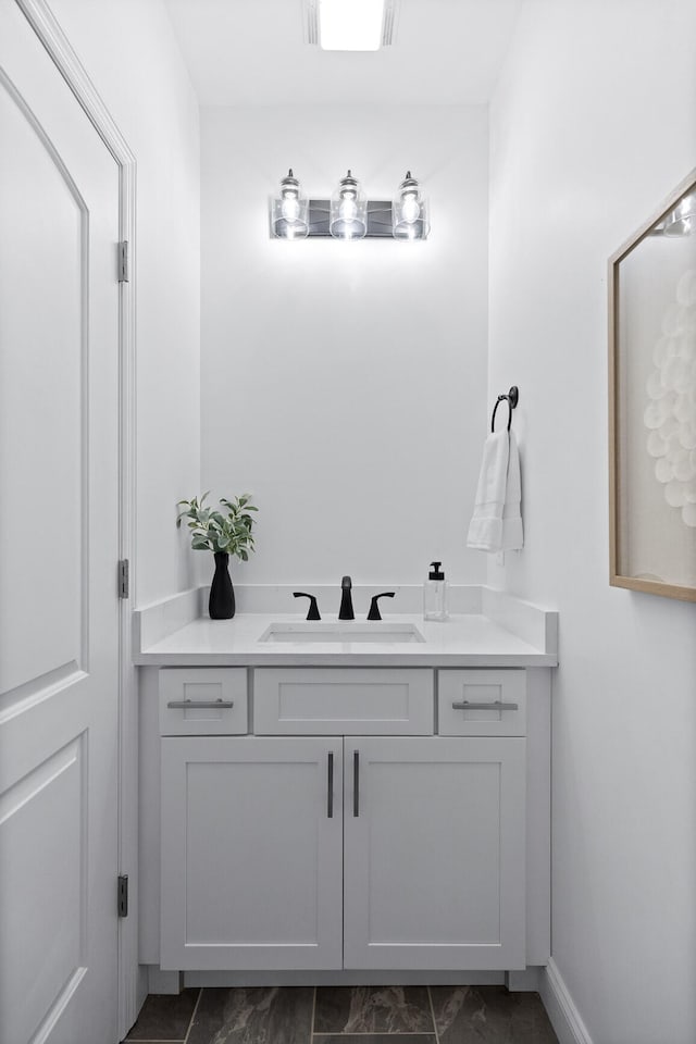 bathroom featuring tile patterned floors and vanity