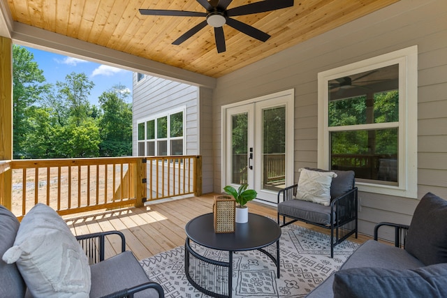 wooden terrace featuring french doors and ceiling fan