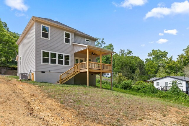 rear view of house with a deck and ceiling fan