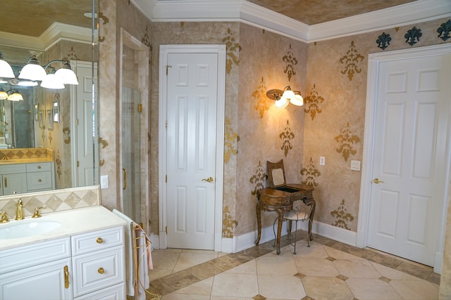 bathroom with ornamental molding, vanity, and tile patterned floors