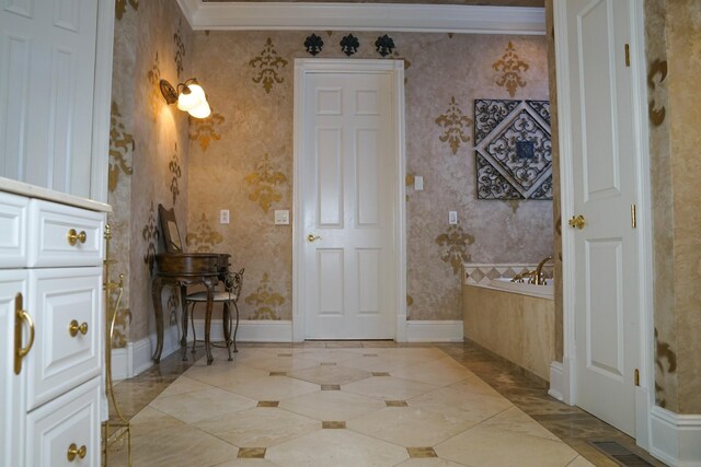 bathroom featuring tile patterned floors and ornamental molding