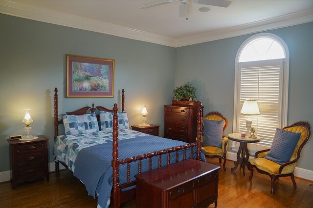 bedroom with crown molding, ceiling fan, and hardwood / wood-style floors