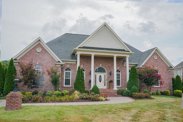 view of front of property with a front lawn