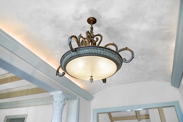 details featuring decorative columns and beam ceiling