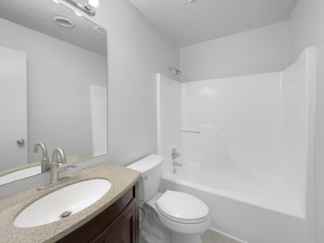 full bathroom with toilet, vanity, a textured ceiling, and shower / tub combination