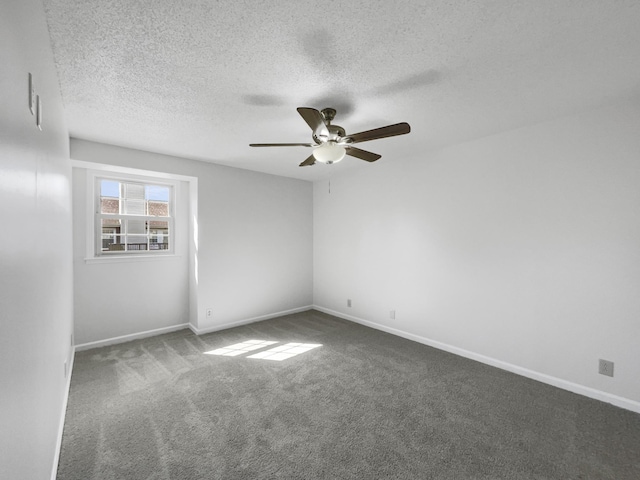 unfurnished room featuring a textured ceiling, ceiling fan, and carpet