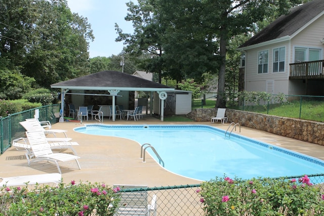 40 Vantage Pt, Counce, TN 38326 - view of pool with a patio, a gazebo, an outbuilding, and view of wooded area