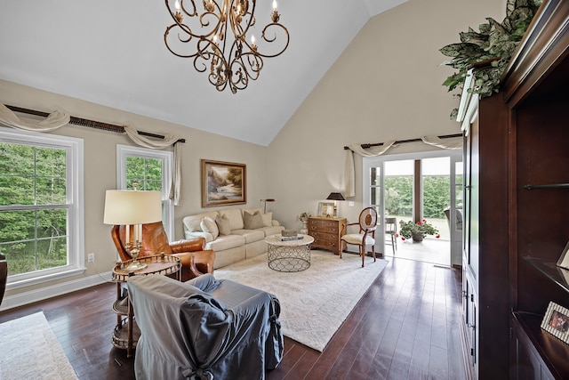 living room with dark hardwood / wood-style floors, high vaulted ceiling, a chandelier, and plenty of natural light