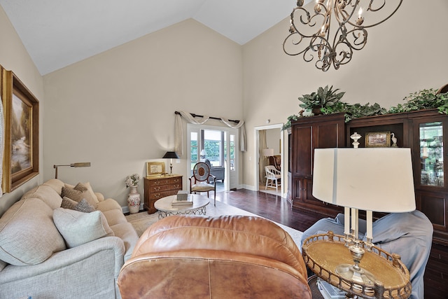 living room with high vaulted ceiling, hardwood / wood-style flooring, and a notable chandelier