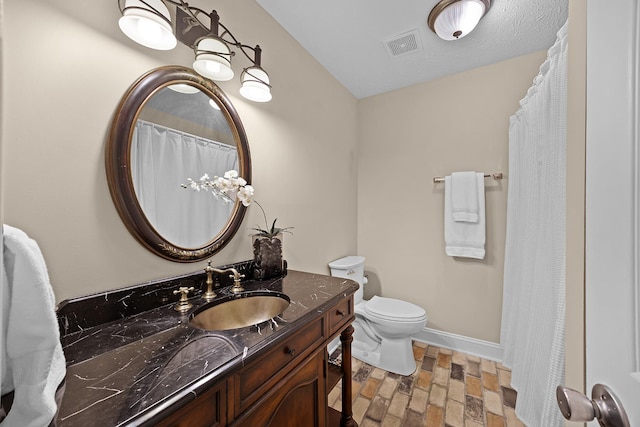 40 Vantage Pt, Counce, TN 38326 - full bathroom featuring vanity, toilet, baseboards, stone finish flooring, and a shower with curtain