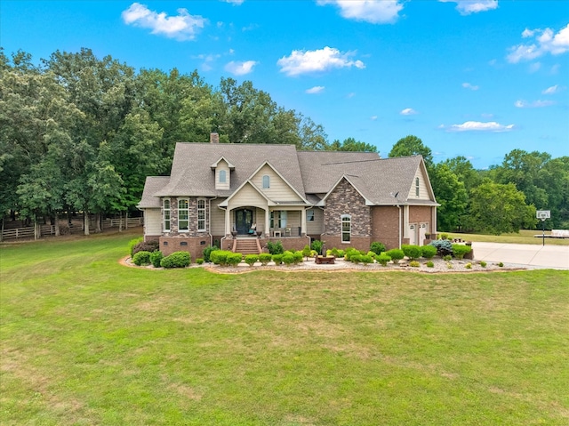 view of front of property with a garage and a front lawn