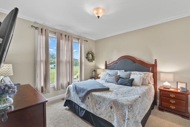 bedroom with light carpet and ornamental molding