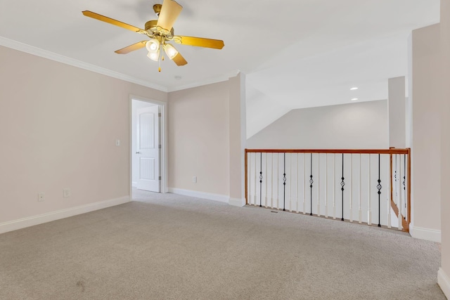 carpeted empty room with ornamental molding and ceiling fan