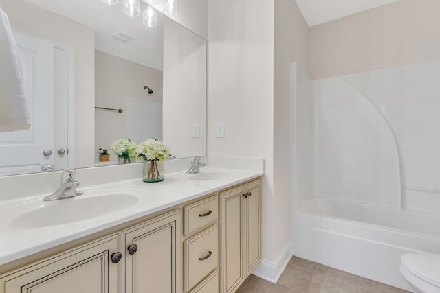 full bathroom featuring tile patterned flooring, vanity, shower / washtub combination, and toilet