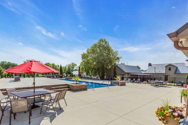 view of swimming pool featuring a patio area