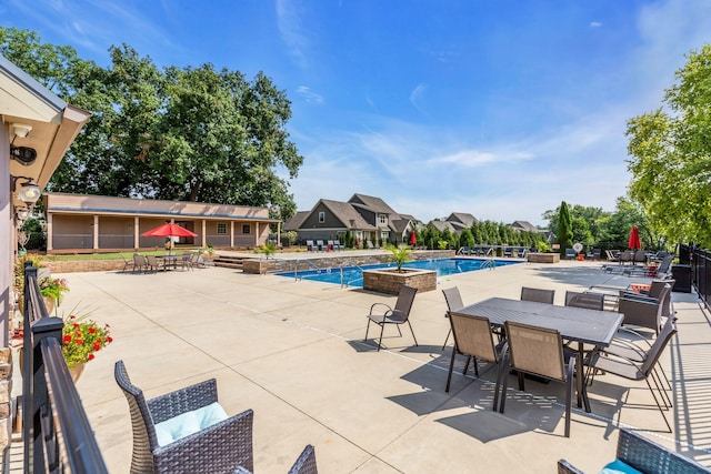 view of pool featuring a patio