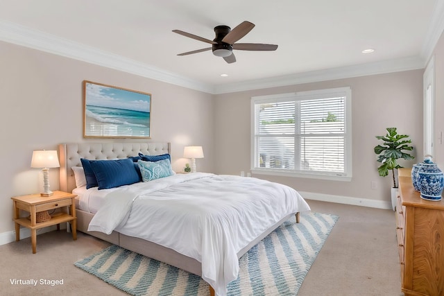 carpeted bedroom with ornamental molding and ceiling fan