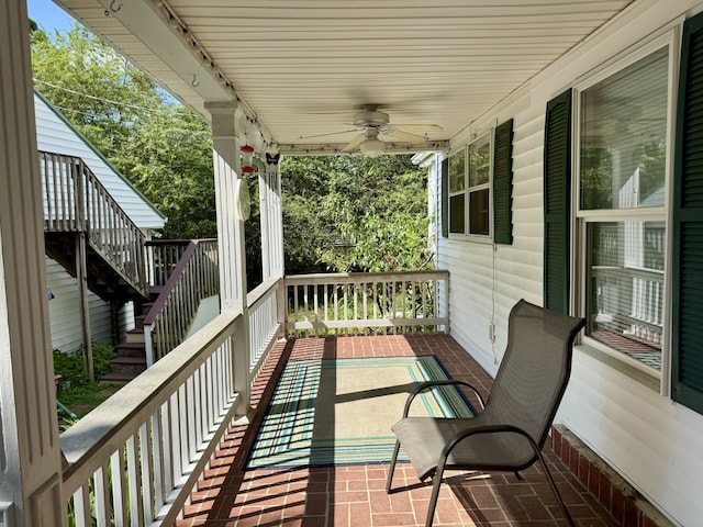 wooden deck featuring ceiling fan