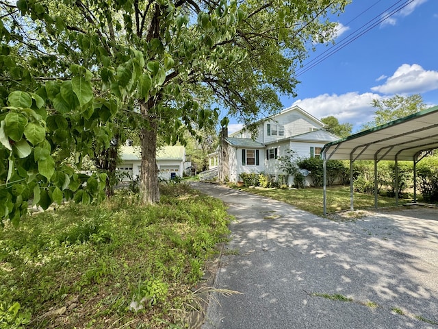 view of front of home with a carport