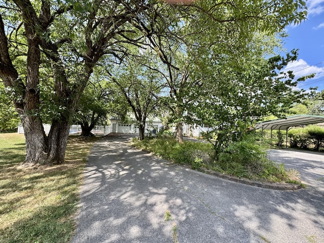 view of front of property featuring a carport