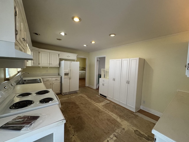 kitchen featuring sink, white cabinets, and white appliances