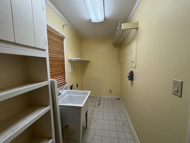 laundry room featuring hookup for an electric dryer, cabinets, crown molding, and hookup for a washing machine