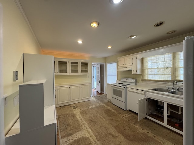 kitchen with white cabinets, white appliances, ornamental molding, and sink