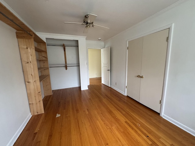 unfurnished bedroom with wood-type flooring, ceiling fan, and ornamental molding