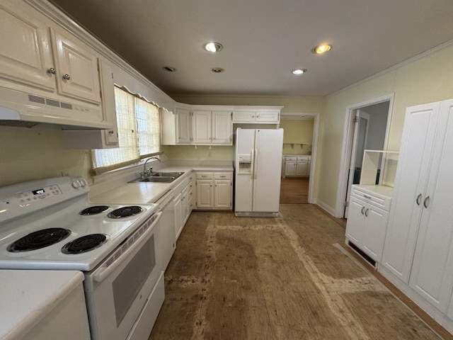 kitchen with white cabinetry, sink, and white appliances