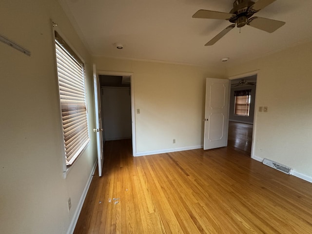 unfurnished room with light wood-type flooring