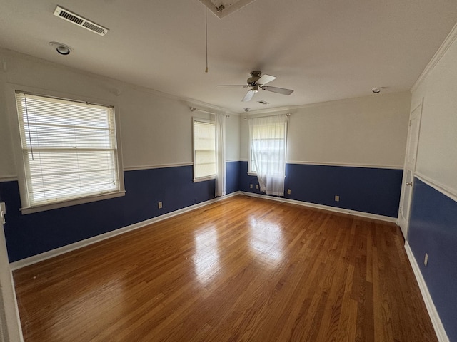 spare room with ceiling fan, hardwood / wood-style flooring, and ornamental molding