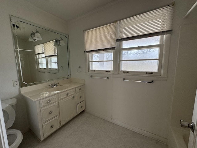 full bathroom with vanity, shower / bath combination, toilet, and a healthy amount of sunlight