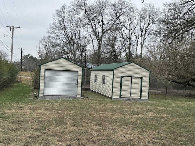 garage featuring a lawn