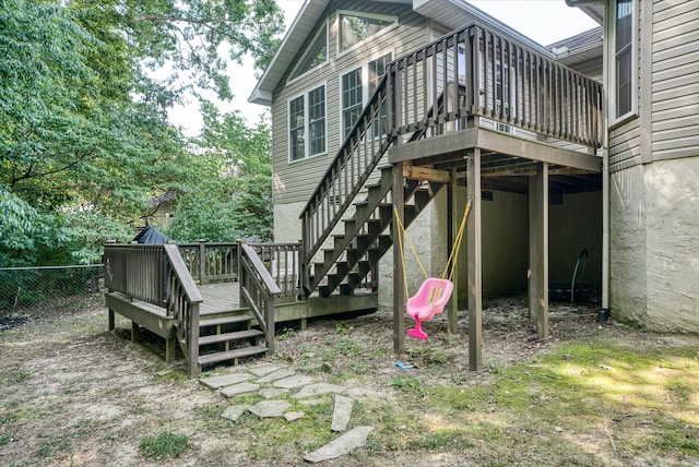 back of house with a wooden deck