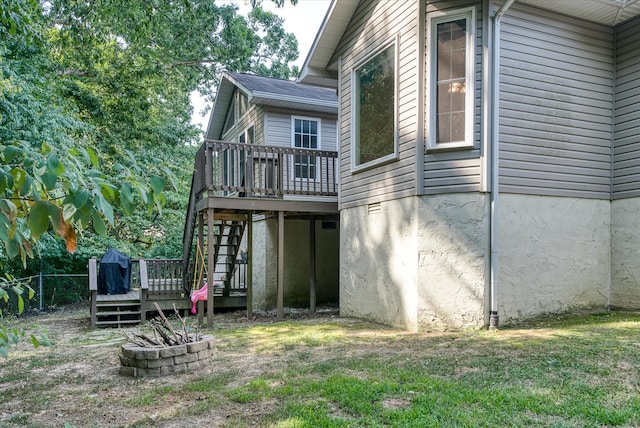 back of property with a wooden deck