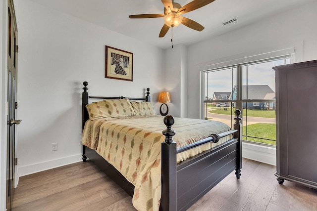 bedroom featuring ceiling fan and hardwood / wood-style floors