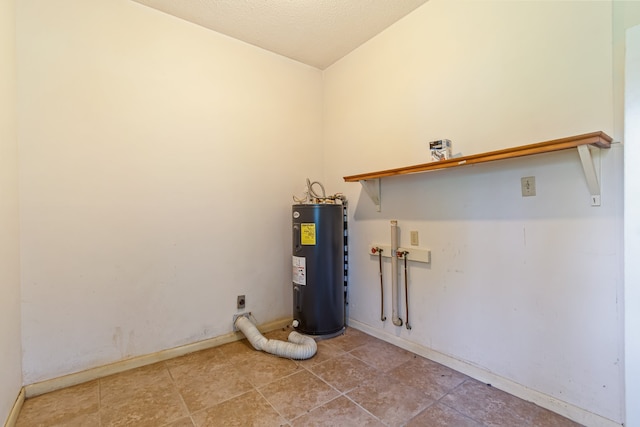 laundry room with electric dryer hookup, tile patterned floors, washer hookup, and water heater