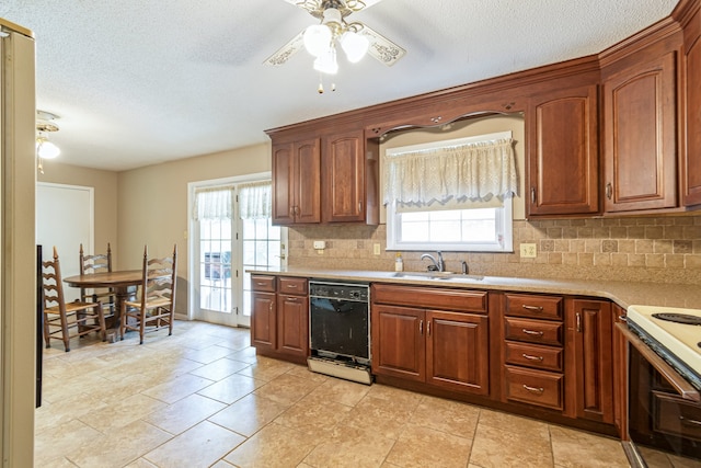 kitchen with ceiling fan, sink, dishwasher, white range, and backsplash