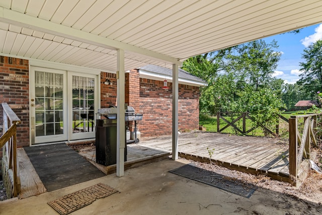 exterior space featuring a deck and a grill