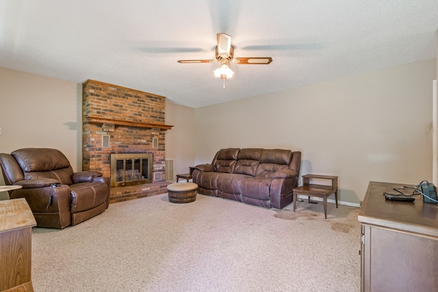 living room featuring light colored carpet, a textured ceiling, a brick fireplace, brick wall, and ceiling fan