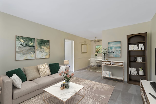 living room with hardwood / wood-style floors and ceiling fan