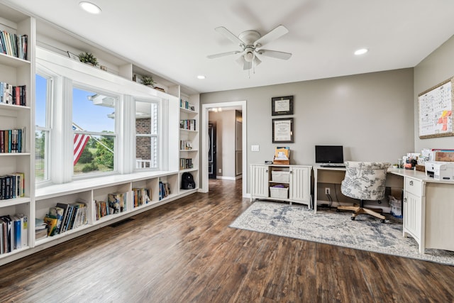 office space featuring ceiling fan, built in shelves, and hardwood / wood-style flooring