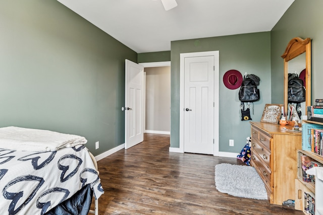 bedroom with dark hardwood / wood-style flooring