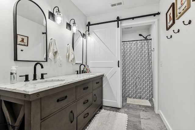 bathroom with tile patterned floors and double sink vanity